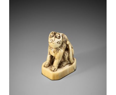 AN AMUSING IVORY NETSUKE OF A TIGERUnsignedJapan, 18th century, Edo period (1615-1868)Finely carved, the tiger seated on a re