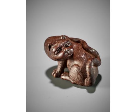 VADYM PYVOVAR: A WOOD NETSUKE OF A TIGERBy Vadym Pyvovar, signed with the artist's markUkraine, 2022Charmingly carved as a ti