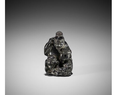 GYOKUSEN: A RARE EBONY WOOD NETSUKE OF A TOSHIOTOKO WITH FOUR ONI DURING SETSUBUNBy Gyokusen, signed Gyokusen 玉川 and kakihanJ