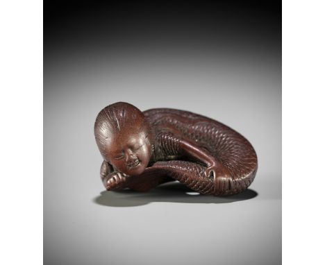TADATOSHI: A SUPERB NAGOYA SCHOOL WOOD NETSUKE OF A NINGYO (MERMAID)By Tadatoshi, signed Tadatoshi 忠利Japan, Nagoya, early 19t