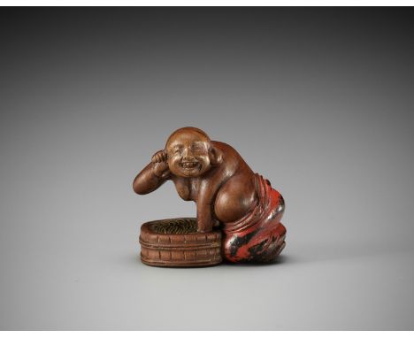 A RARE AND HUMOROUS WOOD AND NEGORO LACQUER NETSUKE OF HOTEI TAKING A BATHUnsigned Japan, late 18th to early 19th century, Ed