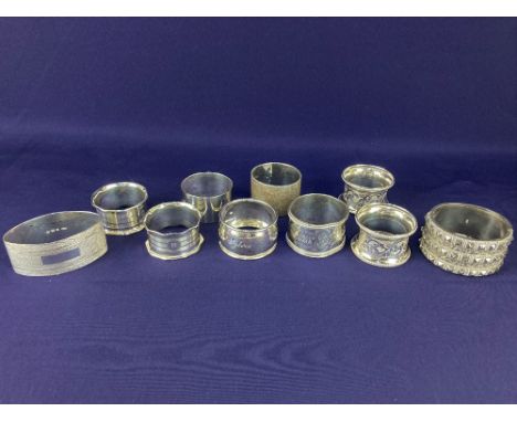 A pair of George V silver napkin rings, makers Sanders &amp; Mackenzie, Birmingham 1926, another pair of napkin rings, makers