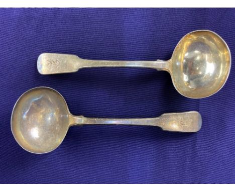 A pair of George III silver fiddle pattern sauce ladles, maker Paul Storr, London 1816, crested with stag and crown, 3.5oz