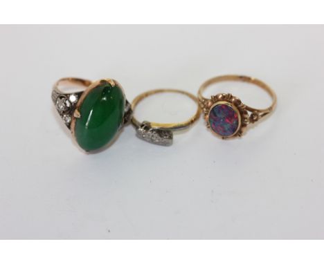 A jade and diamond ring, a black opal doublet ring and a crossover ring