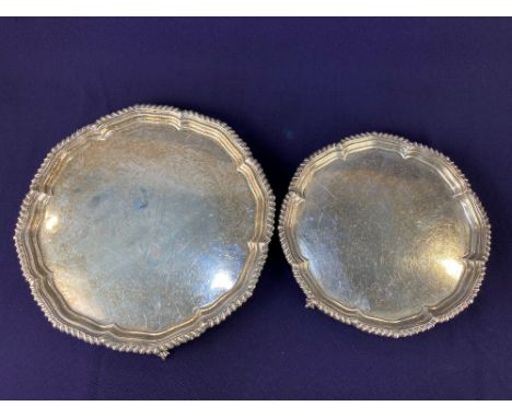 A graduated pair of George V silver salvers, makers Harrison Brothers &amp; Howson, Sheffield 1928, of scalloped form with ga