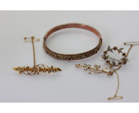 A 9ct gold bangle set with garnets and split pearls; a 9ct gold and split pearl brooch, a 9ct gold, garnet and split pearl ci