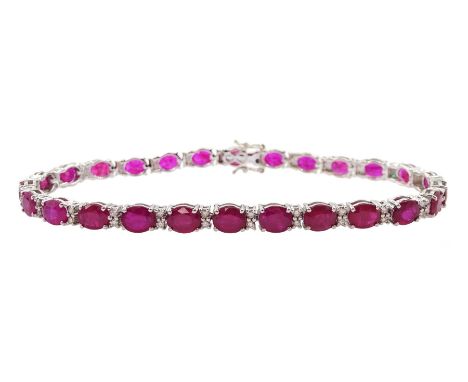 18ct white gold oval ruby and diamond bracelet, total ruby weight approx 9.80 caratCondition Report:Approx 9.9gm, length = 17