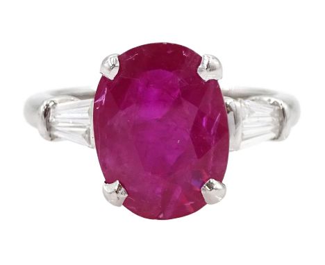 18ct white gold oval cut ruby ring, with two baguette cut diamonds set either side, hallmarked, ruby 4.16 carat, with Holts L