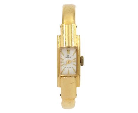 Martine ladies 18ct gold manual wind wristwatch, hallmarked, on 18ct gold hinged bangle, stamped 750Condition Report:Approx 7
