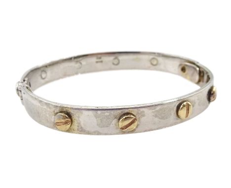 9ct white gold child's bangle with yellow gold screws, hallmarkedCondition Report:Approx 18.55gm, inner circumference = 14.5c