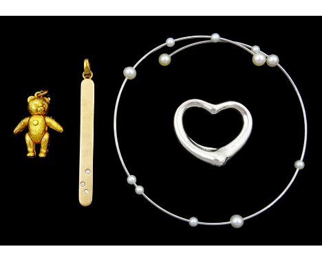 Tiffany & Co silver open heart pendant by Elsa Peretti, 9ct gold diamond pendant, gilt teddy bear pendant and a pearl bangleC