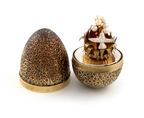 By Stuart Devlin, a modern silver-gilt, silver and seed pearl surprise egg, London 1977, limited edition number 35 of 300, ov