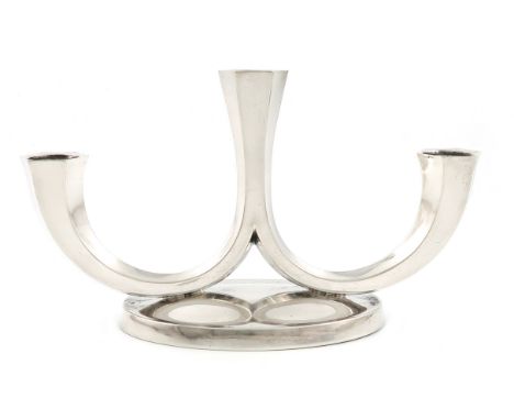 A German three-light silver candelabrum, by M. Wilkens and Son, with a central light and two faceted scroll arms each support