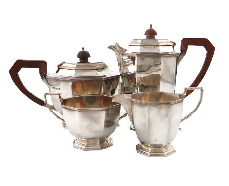 A four-piece silver tea set, by Mappin and Webb, Sheffield 1973 and 1975, octagonal form, scroll handle, the hinged cover wit