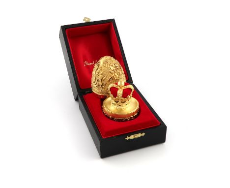 By Stuart Devlin, a cased modern commemorative silver-gilt and enamel surprise egg, London 1977, limited edition number 33 of