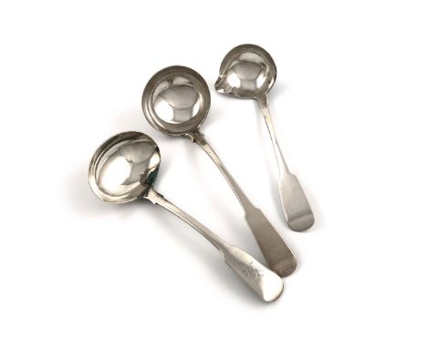 A George IV Irish silver Fiddle pattern sauce ladle, by James Scott, Dublin 1820, the terminal with a crest, plus an Irish la