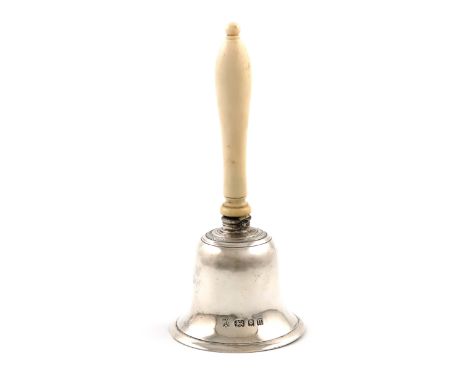 λA silver and ivory table bell, by R. Comyns, London 1928, conventional form, turned baluster ivory handle, height 12.8cm, ap