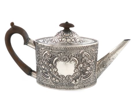 A George III Scottish silver teapot, by W and P Cunningham, Edinburgh 1784, oval form, later embossed foliate scroll decorati