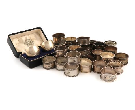 A large collection of silver napkin rings, various dates and makers, including: a cased pair by Martin, Hall and Co, Sheffiel