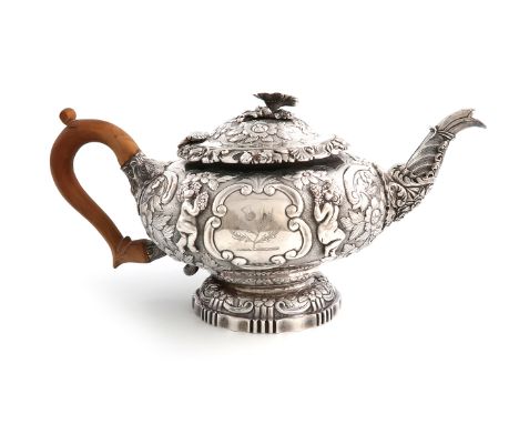 A George IV silver teapot, by John Houle, London 1823, circular bellied form, embossed and chased with putti holding grapes, 