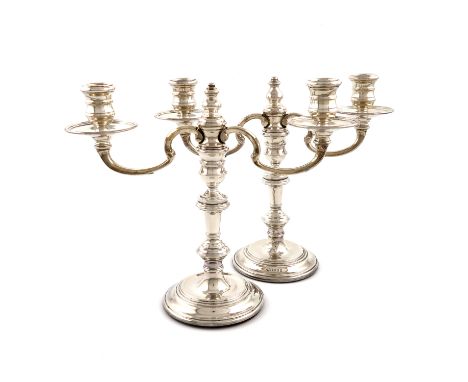 A pair of modern silver two-light candelabra, by Nat Leslie, London 1967, in the George I manner, knopped baluster stems, scr