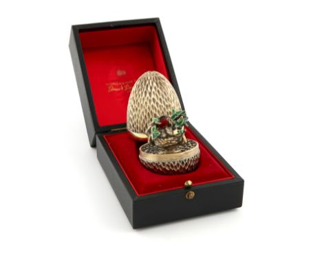 By Stuart Devlin, a modern cased silver, silver-gilt and enamel surprise egg, London 1976, limited edition number 50 of 300, 