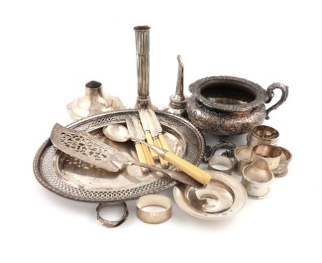 λA mixed lot, comprising silver items: an Armada dish, a set of four napkin rings, five further napkin rings, a broken candle