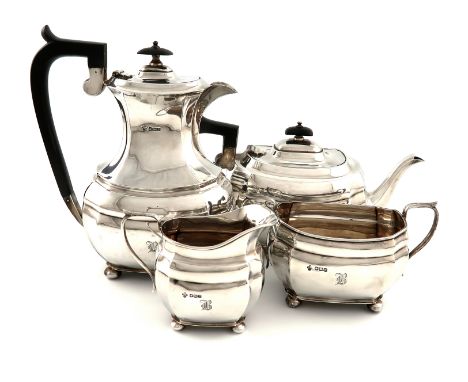 A four-piece silver tea set, by Jay, Richard Attenborough Co Ltd, Sheffield 1922, shaped oblong form, scroll handles, on four