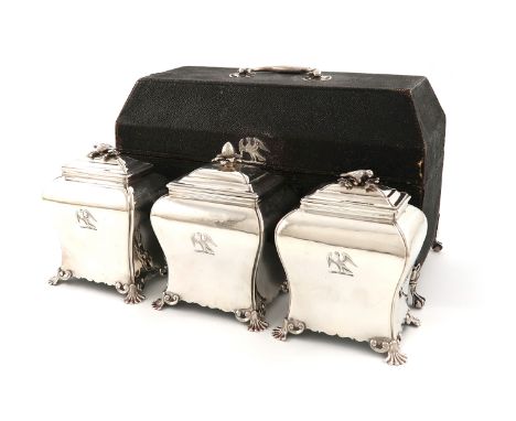 A suite of two George III silver tea caddies and a sugar box, by Pierre Gillois, London 1755, rectangular bombé form, pull-of