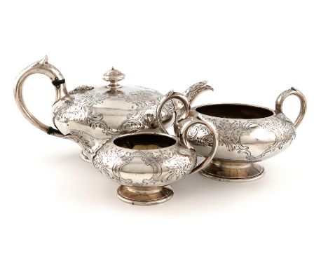 A three-piece Victorian silver tea set, by The Barnards, London 1861, compressed circular form, engraved foliate scroll decor