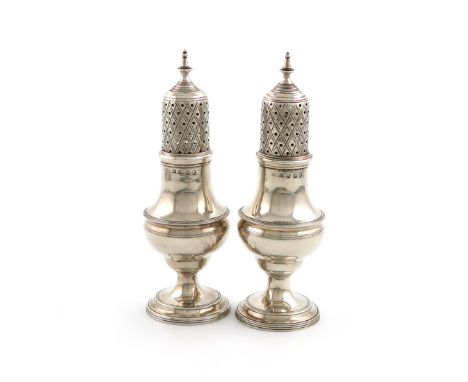 A pair of George III silver pepper pots, Crispin Fuller, London 1801, baluster form, reeded borders, the pierced covers with 