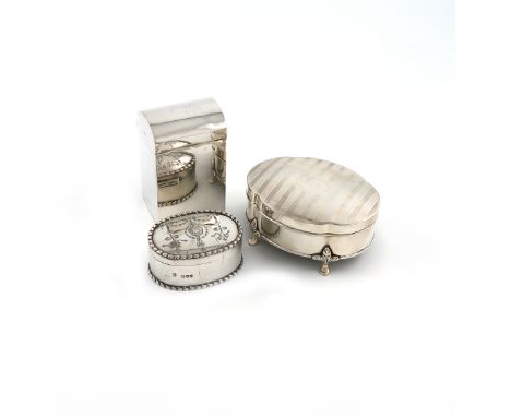 A small collection of three silver boxes, comprising: a playing cards box, of upright rectangular form, domed cover, by Natha