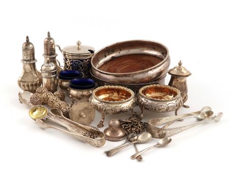 A mixed lot of silver items, comprising: a mustard pot of circular form, pierced foliate scroll decoration, blue glass liner,