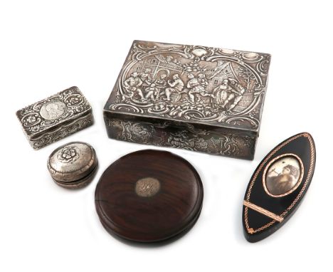 λA mixed lot, comprising silver items: a Georg Jensen box, of circular form, the cover embossed with a flower, a continental 
