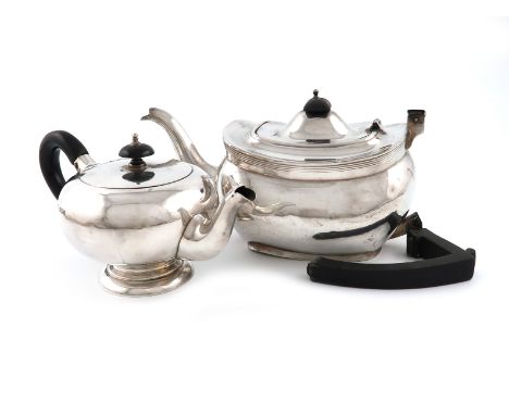 A silver teapot, maker's mark partially worn, Chester 1911, oblong bellied form, the scroll handle a.f, plus a silver bachelo