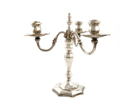 A modern silver three-light candelabrum, by R. Comyns, London 1966, octagonal baluster stem, with three scroll branches each 