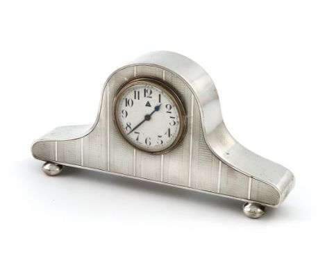 A silver mantle clock, by Charles S Green &amp; Co Ltd, Birmingham date letter worn, arched rectangular form, with bands of e