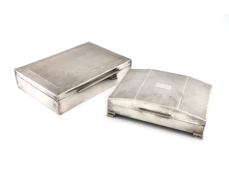 A silver cigarette box, by the Harman Brothers, Birmingham 1956, rectangular form, slanted cover with engine-turned decoratio