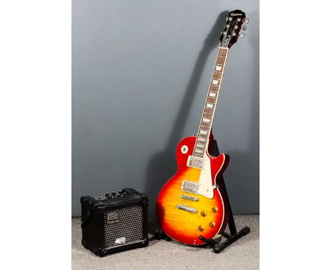 An Epiphone Les Paul Standard Pro Electric Guitar, Serial No. 13112304753, and a Roland Micro Cube COSM amplifier
