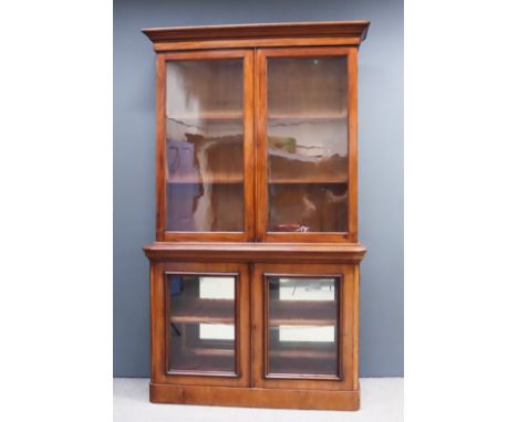 A Victorian Mahogany Chiffonier Bookcase, the upper part with moulded cornice, fitted two shelves enclosed by a pair of glaze