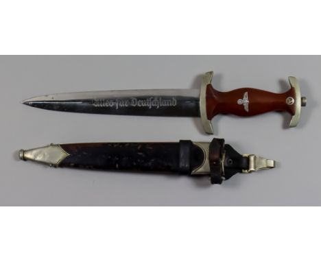 A World War II NSKK Dagger,by Eickelberg Mack, 8ins double edge bright steel blade etched with "alles fur Deutschland", and m