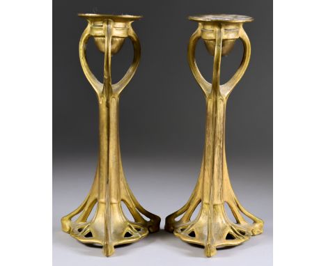 A Pair of Gilt Metal Pillar Candlesticks in Art Nouveau Manner, Late 19th Century, cast with a sinuous design, on triangular 