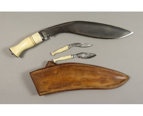 A Good 20th Century Broad Leaf Kukri, No. 899, in substantial leather scabbard, fitted with bone hilt