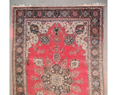 A Meshad Carpet, Early to Mid 20th Century, woven in colours with central star shaped medallion and conforming spandrels on a