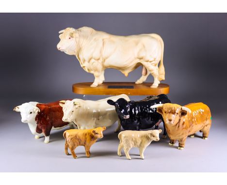 A Beswick Pottery 'Connoisseur' Model of a Charolais Bull, Issued 1971-79, on oval wooden plinth, 7.5ins high, a standing Hig