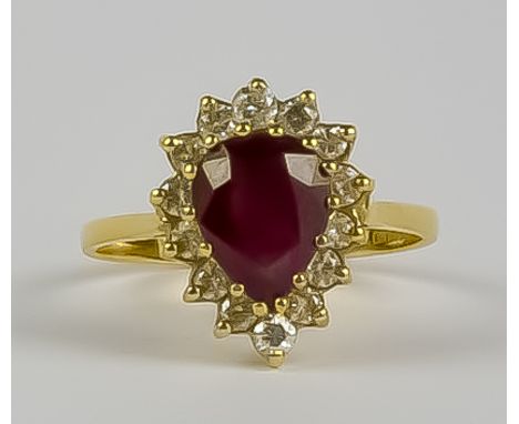 A Ruby and Diamond Ring, Modern, 18ct yellow gold, set with a centre pear shaped ruby, approximately .75ct, surrounded by bri