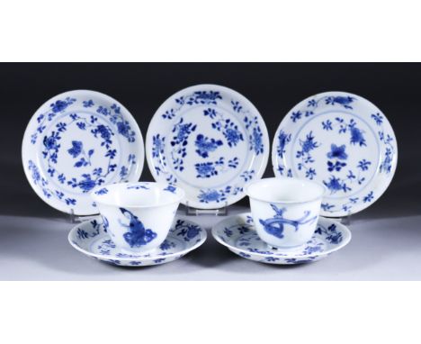 A Chinese Porcelain Blue and White Plate of Shaped Outline, Kangxi Period, the centre painted with flowering shrubs issuing f