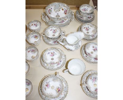  A Coalport part tea service,   decorated with floral sprays  
