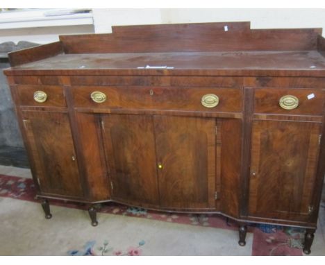 A mixed lot to include a mahogany sideboard, twin pedestal dining table, 19th Century breakfast table, a bookcase and an oak 