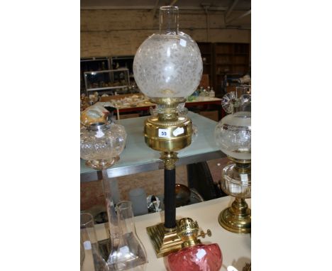  A brass and clear glass oil lamp  , another, a silver coloured metal and clear glass oil lamp, and assorted coloured glass o